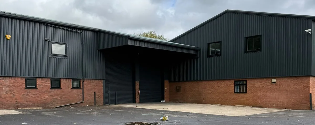 The same industrial unit after spraying, cladding and trim in dark anthracite